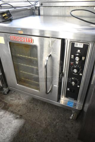2019 Blodgett CTB-1 Stainless Steel Commercial Electric Powered Half Size Convection Oven w/ View Through Door, Metal Oven Racks and Thermostatic Controls on Commercial Casters. 208-240 Volts, 3 Phase.