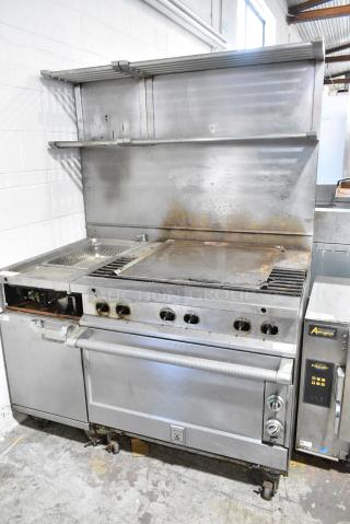 Hestan Stainless Steel Commercial Natural Gas Powered Flat top Griddle w/ 3 Burner Range, Pasta Cooker and Convection Oven on Commercial Casters.
