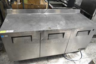 True TWT-72 Stainless Steel Commercial 3 Door Work Top Cooler on Commercial Casters. 115 Volts, 1 Phase. Tested and Does Not Power On