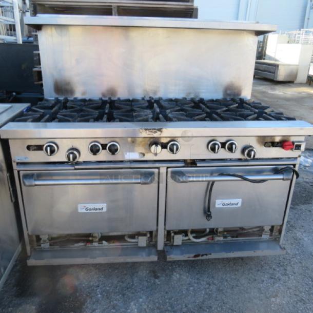 One Garland 10 Burner Natural Gas Range With SS Over Shelf On Casters. - Image 1 of 4