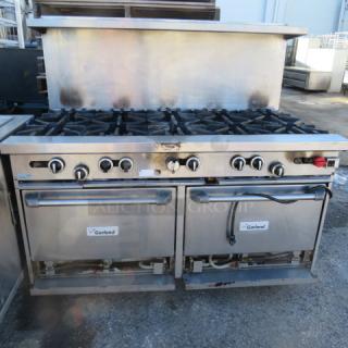 One Garland 10 Burner Natural Gas Range With SS Over Shelf On Casters.