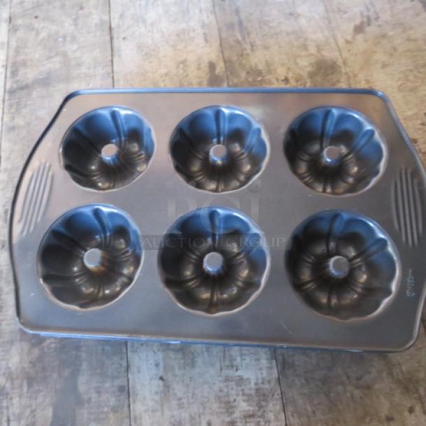 One Wilton 6 Hole Mini Bundt Cake Pan. - Image 1 of 1
