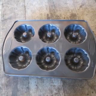One Wilton 6 Hole Mini Bundt Cake Pan.