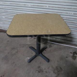 One Beige Laminate Table Top On A Pedestal Base. 24X30X29
