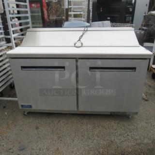 One WORKING 2 Door Arctic Air Refrigerated Prep Table With Cutting Board, And 2 Racks On Casters.  Model# AST60RZ. 115 Volt. 60X30X43.5.  $2799.00.