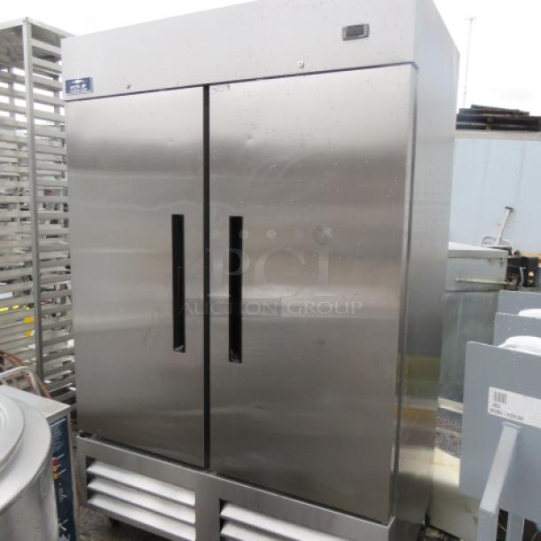 One WORKING 2 Door Stainless Steel Arctic Air Freezer With 4 Racks On Casters. 115 Volt. Model# AF49EX. 53.5X33X83. $3545.00 - Image 1 of 3