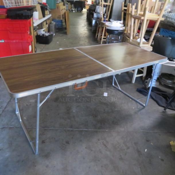 One Folding Table With A Laminate Top And A Carry Handle. 72X30X30 - Image 1 of 2