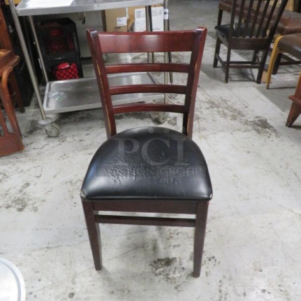 Wooden Chair With A Black Cushioned Seat.. 2XBID - Image 1 of 1