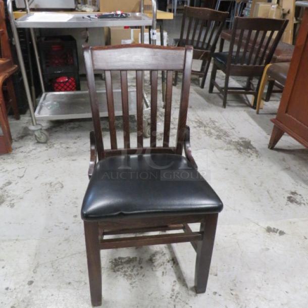 Wooden Chair With A Black Cushioned Seat. 2XBID - Image 1 of 1