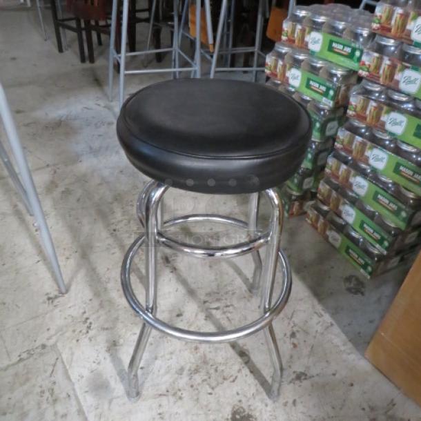 Chrome Ring Barstool With A Black Cushioned Swivel Seat. 2XBID - Image 1 of 1