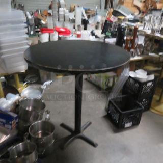 One Black Laminate Table Top On A Bar Height Pedestal Base. 30X41.5