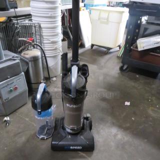 One Eureka Vacuum With Extra Tank.