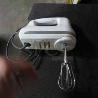 One Kitchenaid 3 Speed Hand Mixer.
