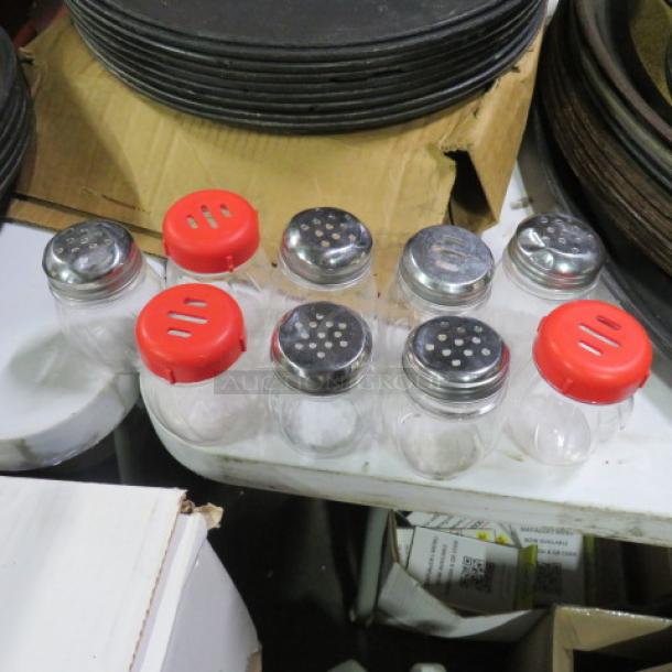 One Lot Of 9 Cheese/Pepper Shakers. - Image 1 of 1