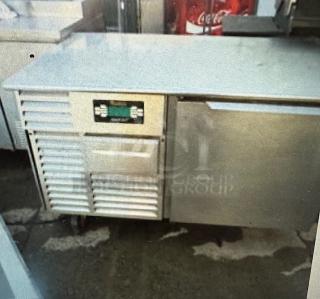 One Traulsen Stainless Steel 1 Door 50lb Smart Chill Blast Chiller Freezer With 3 Racks On Casters. Model# RBC50-ZWM12. 115 Volt. 54X34X33