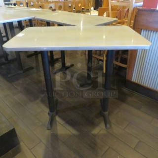 One Laminate Table Top On Dual Bar Height Pedestal Bases. 48X30X42