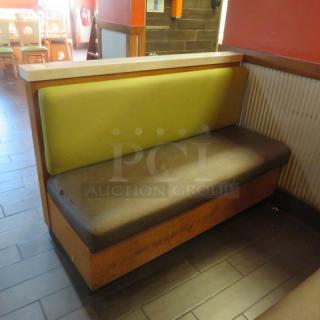 One Single Sided Wooden Booth With A Green Cushioned Back And A Brown Cushioned Seat, And a Finished Back, And Marble Top.    60.5X27X41