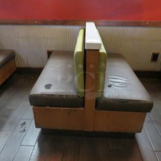 One Double Sided Wooden Booth With A Green Cushioned Back And A Brown Cushioned Seat, And Marble Top.    60.5X48X41