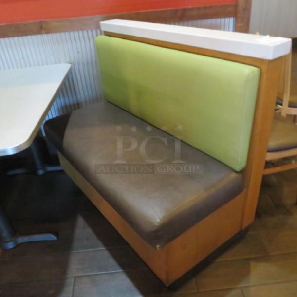 One Single Sided Wooden Boothe With A Green Cushioned Back And Brown Cushioned Seat, With A Marble Top, And Finished Back. 48.5X27X41 - Image 1 of 2
