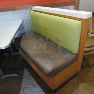 One Single Sided Wooden Boothe With A Green Cushioned Back And Brown Cushioned Seat, With A Marble Top, And Finished Back. 48.5X27X41