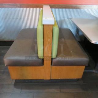 One Double Sided Wooden Boothe With A Green Cushioned Back And Brown Cushioned Seat, With A Marble Top. 48.5X48X41
