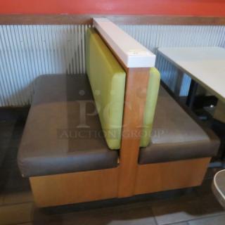 One Double Sided Wooden Boothe With A Green Cushioned Back And Brown Cushioned Seat, With A Marble Top. 48.5X48X41