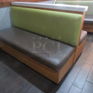 One Double Sided Wooden Booth With A Green Cushioned Back And Brown Cushioned Seat, With A Marble Top. 60.5X48X41