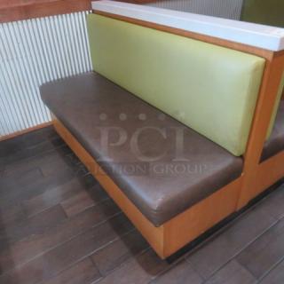 One Double Sided Wooden Booth With A Green Cushioned Back And Brown Cushioned Seat, With A Marble Top. 60.5X48X41