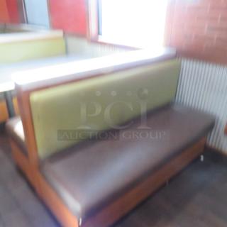 One Double Sided Wooden Booth With A Green Cushioned Back And Brown Cushioned Seat, With A Marble Top. 60.5X48X41
