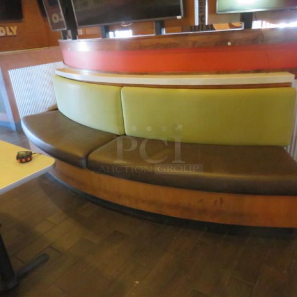 One Half Circle Wooden Bench With A Green Cushioned Back And  A Brown Cushioned Seat. 120X27X41 - Image 1 of 2