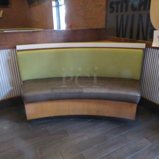 One Half Circle Wooden Bench With A Green Cushioned Back And  A Brown Cushioned Seat. 69X27X41 - Image 1 of 1