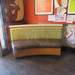 One Half Circle Wooden Bench With A Green Cushioned Back And  A Brown Cushioned Seat. 69X27X41