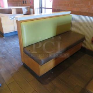 One Single Sided  Wooden Booth With A Green Cushioned Back And  A Brown Cushioned Seat, Finished Back, And Marble Top. 60.5X27X41