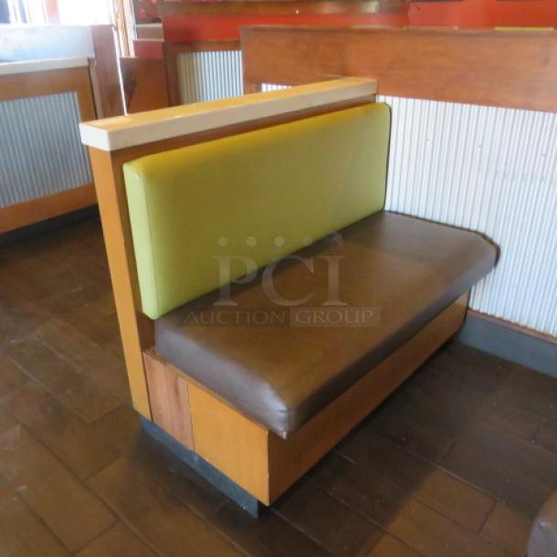 One Single Sided  Wooden Booth With A Green Cushioned Back And  A Brown Cushioned Seat, A Finished Back, And Marble Top. 48.5X27X41 - Image 1 of 2