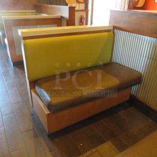One Single Sided  Wooden Booth With A Green Cushioned Back And  A Brown Cushioned Seat, A Finished Back, And Marble Top. 48.5X27X41