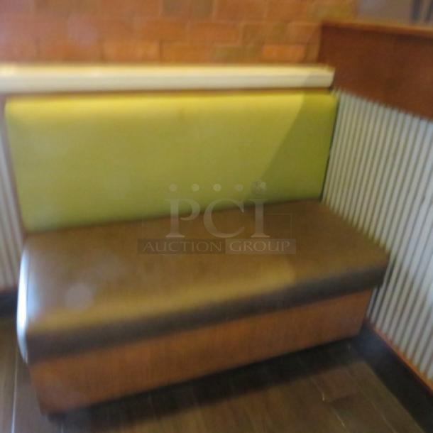 One Single Sided  Wooden Booth With A Green Cushioned Back And  A Brown Cushioned Seat, And Marble Top. 48.5X27X41 - Image 1 of 1