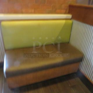 One Single Sided  Wooden Booth With A Green Cushioned Back And  A Brown Cushioned Seat, And Marble Top. 48.5X27X41