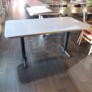 One Lamanite Table Top On Dual Pedestal Bases. 60X30X30