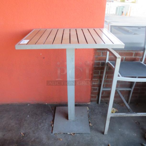 One Aluminum/Wooden Bar Height Patio Table. 32X24X43 - Image 1 of 2