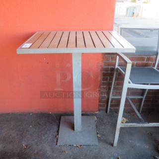 One Aluminum/Wooden Bar Height Patio Table. 32X24X43