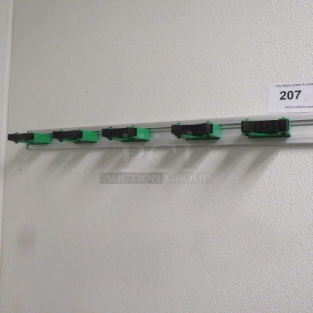 One Wall Mount Mop/Broom Holder. - Image 1 of 1