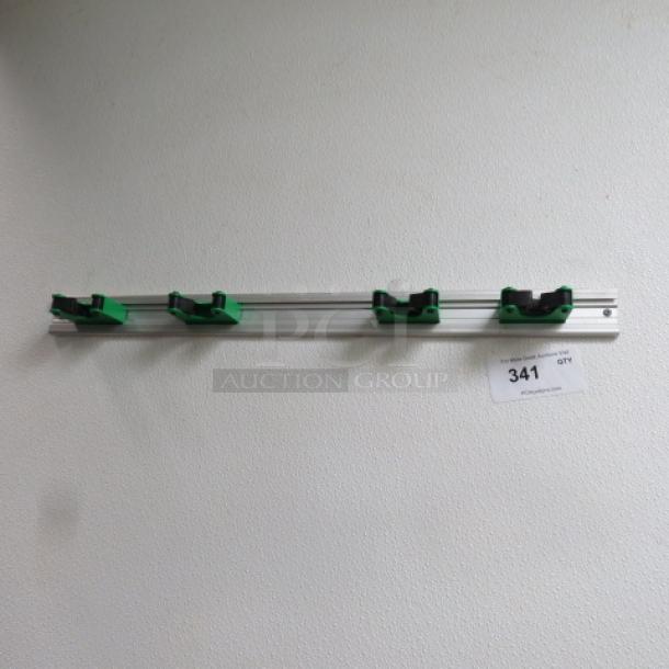 One Wall Mount Mop/Broom Holder. - Image 1 of 1