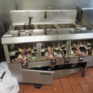 One Henny Penny  Natural Gas 3 Vat Open Fryer On Casters With 6 Baskets. Model# OFG-323.  120 Volt. Missing Front Panels, And 1 Bottom Door. 49.5X33.5X44. $25,367.00