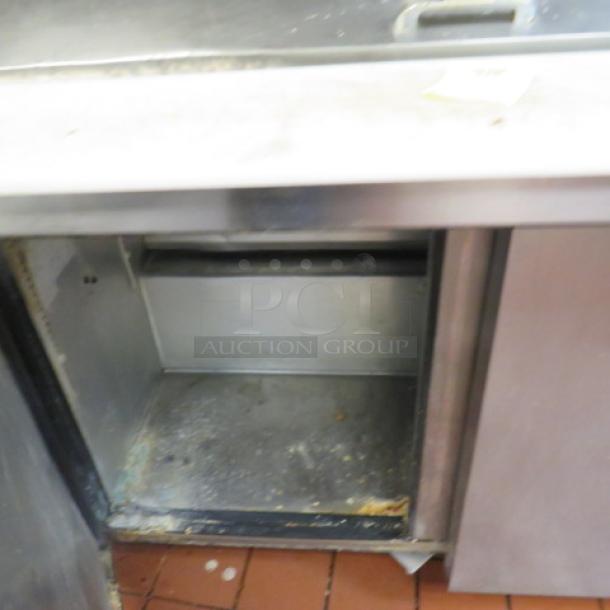 One True 2 Door Refrigerated Prep Table With Cutting board On Casters. 115 Volt. Model# TSSU-48-18M-B. 48X34X46.5. $4810.00 - Image 2 of 2
