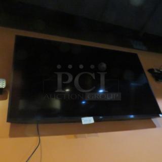 One 65 Inch LG Wall Mount TV.