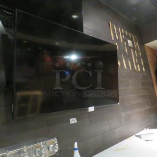 One 70 Inch Sharp Wall Mount TV.