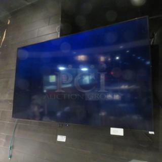 One 70 Inch Aquos Wall Mount TV.