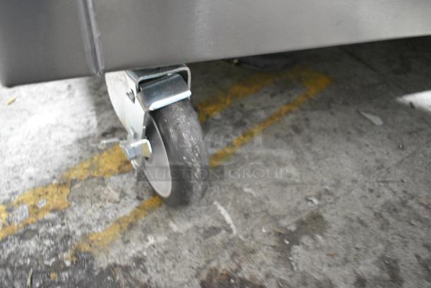 BRAND NEW SCRATCH AND DENT! 2022 Delfield SH-4 Stainless Steel Commercial Floor Style 4 Bay Steam Table on Commercial Casters. 120/208 Volts, 1 Phase. - Image 4 of 13
