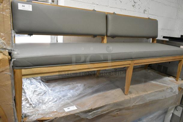 BRAND NEW SCRATCH AND DENT! Wooden Single Sided Bench w/ Gray Seat Cushions. - Image 1 of 3