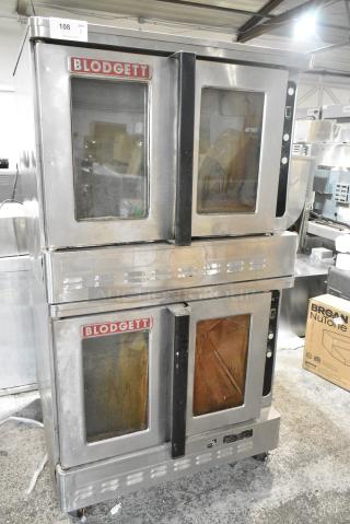 2 Blodgett Stainless Steel Commercial Natural Gas Powered Full Size Convection Oven w/ View Through Doors and Thermostatic Controls on Commercial Casters. 2 Times Your Bid!